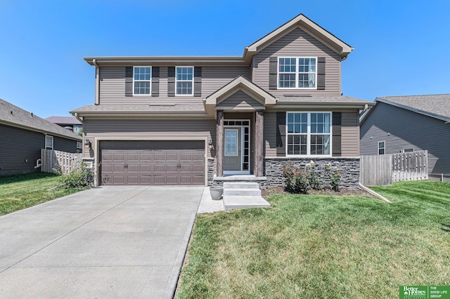 view of front of home featuring a front yard and a garage