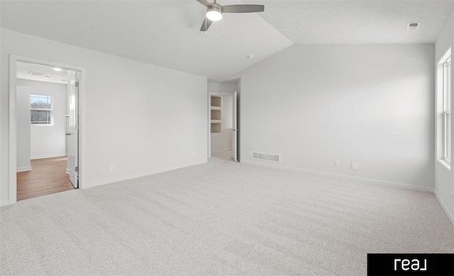 5508 Brook St, Papillion, NE 68133 - unfurnished bedroom featuring carpet, lofted ceiling, baseboards, and ceiling fan
