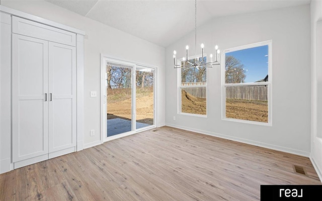 5508 Brook St, Papillion, NE 68133 - unfurnished dining area featuring a chandelier, light wood-style flooring, vaulted ceiling, and baseboards