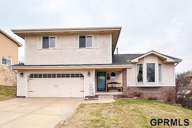 view of front property with a front yard and a garage