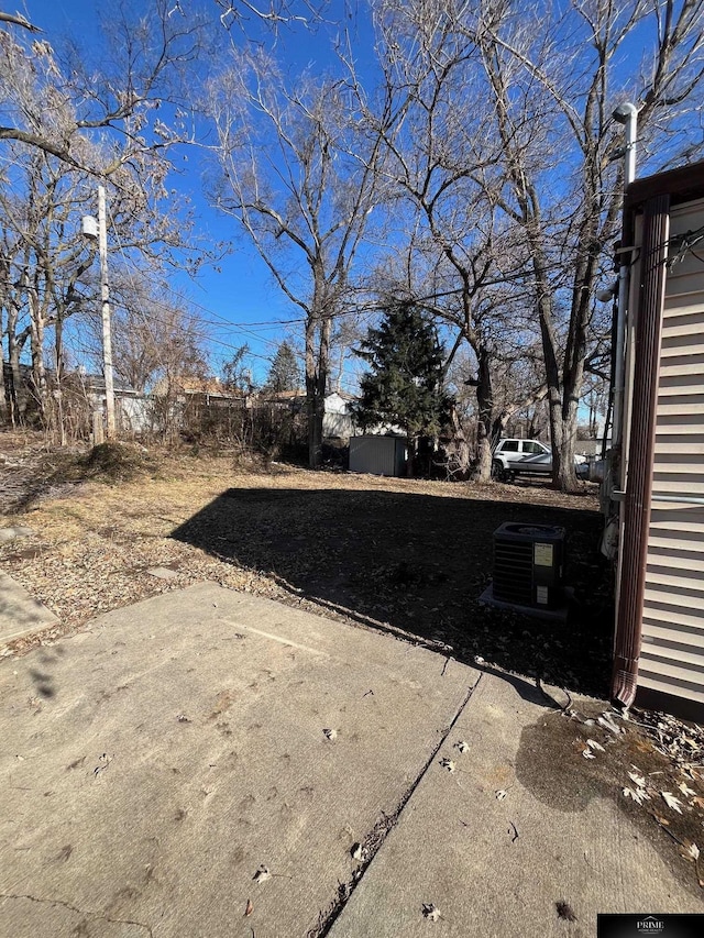 view of yard with a patio area and cooling unit