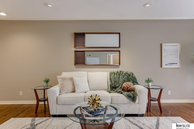 living room with dark hardwood / wood-style floors