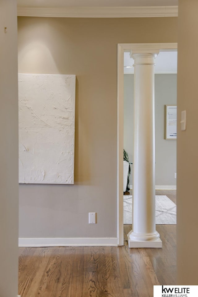 spare room featuring hardwood / wood-style floors and ornamental molding