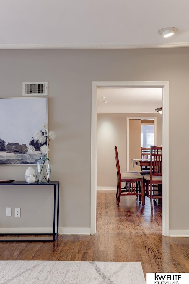 dining space with hardwood / wood-style floors