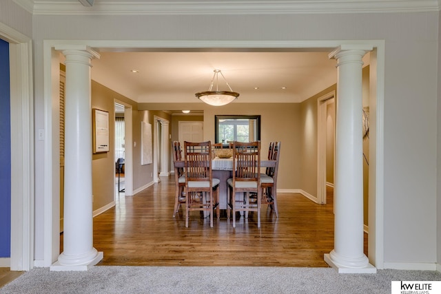 dining space featuring carpet flooring and crown molding