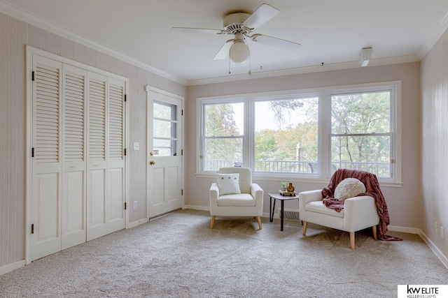 sitting room with a wealth of natural light, ceiling fan, and ornamental molding