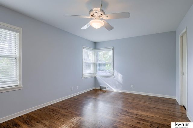 unfurnished bedroom with ceiling fan and dark hardwood / wood-style floors