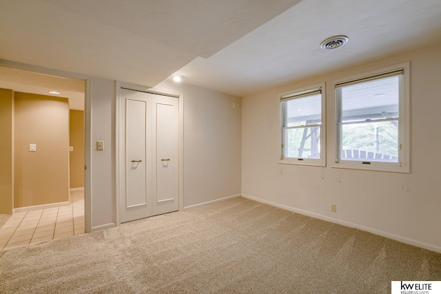 interior space featuring light colored carpet