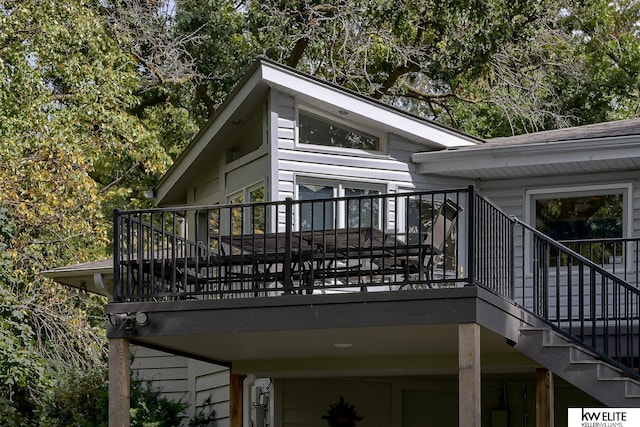 view of side of property with a wooden deck