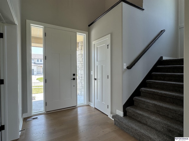 foyer entrance with light hardwood / wood-style flooring