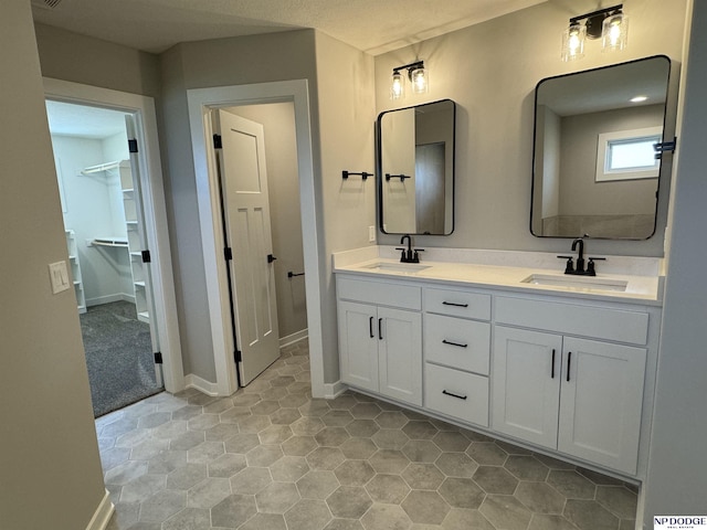 bathroom featuring tile patterned floors and vanity