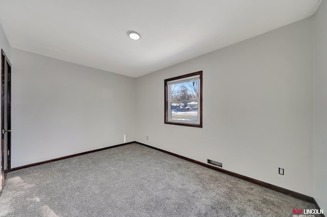 empty room featuring light carpet