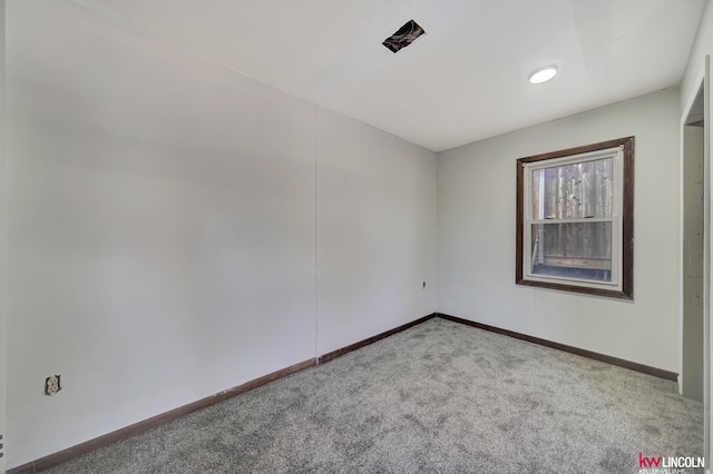 empty room with light colored carpet