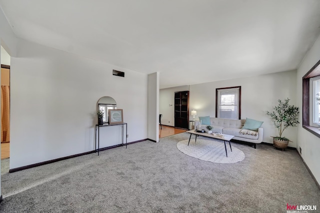 unfurnished living room with light carpet