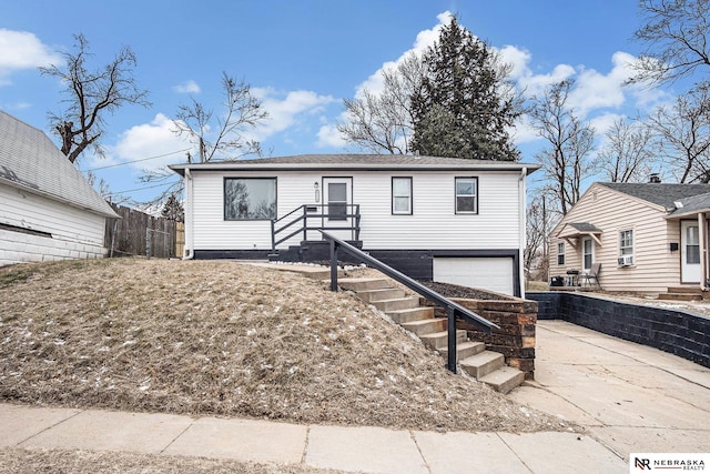 view of front of property with a garage