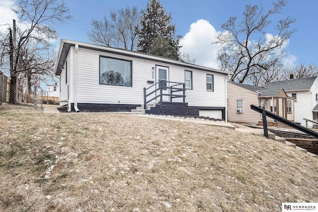 view of front of property with a front lawn