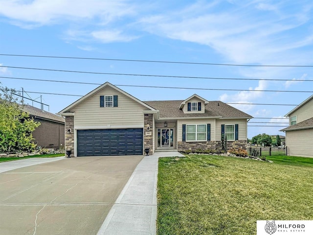 view of front of house featuring a front lawn and a garage