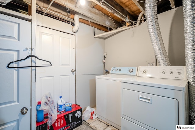 clothes washing area featuring washing machine and dryer