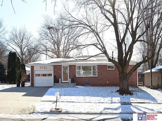 single story home featuring a garage