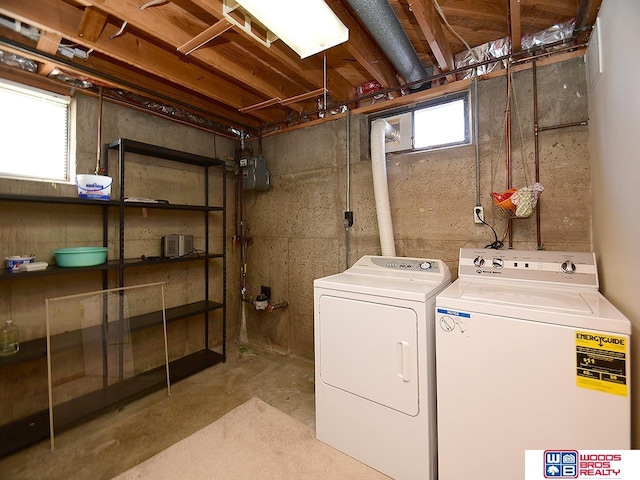 clothes washing area with washer and dryer