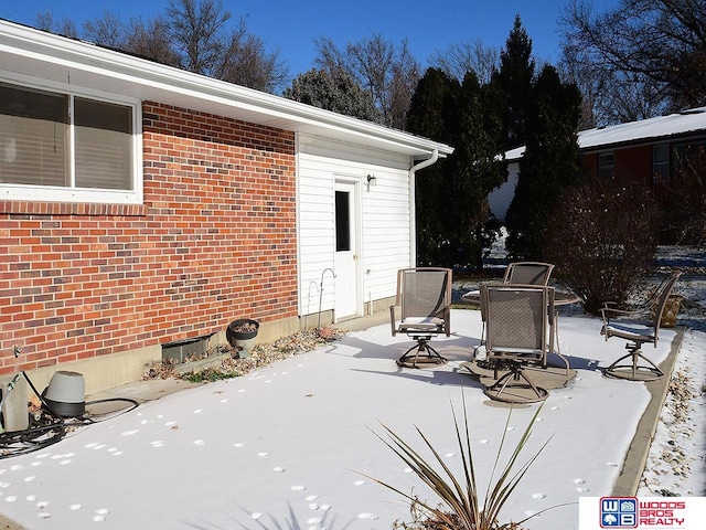 view of snow covered patio