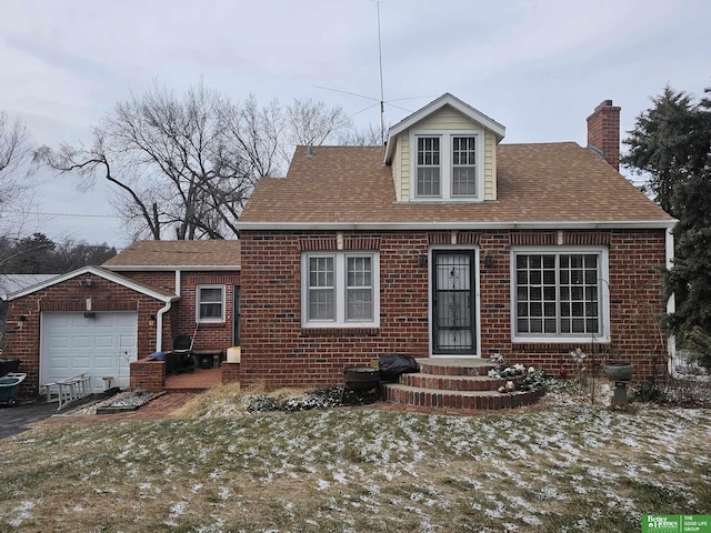 view of front of house with a garage and a front lawn