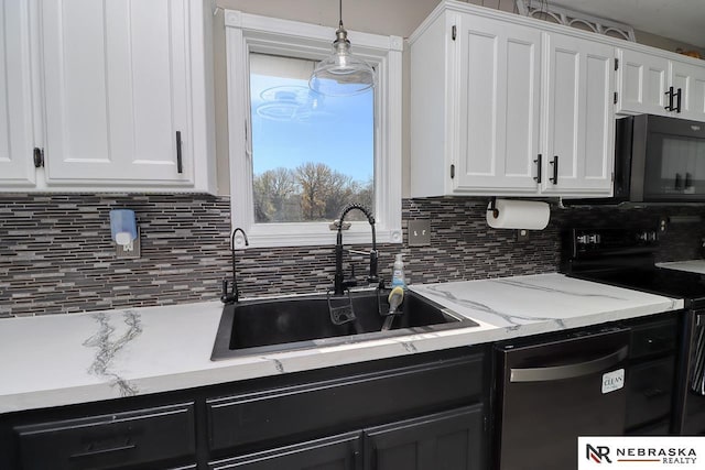 kitchen featuring sink, backsplash, pendant lighting, white cabinets, and black appliances