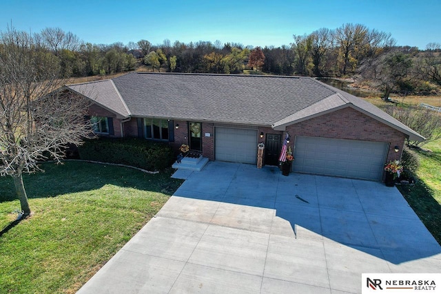 single story home with a garage and a front yard