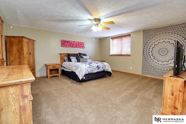 bedroom with carpet flooring, ceiling fan, and a textured ceiling