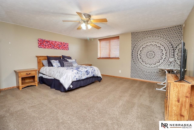 bedroom with carpet flooring, ceiling fan, and a textured ceiling