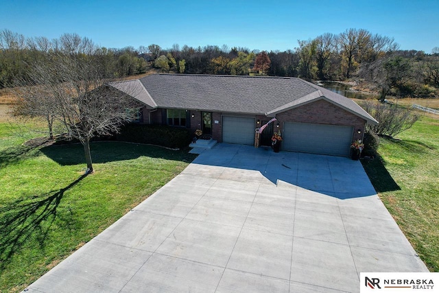 ranch-style house with a garage and a front lawn