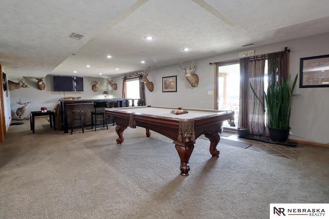 playroom featuring a textured ceiling, indoor bar, a healthy amount of sunlight, and billiards