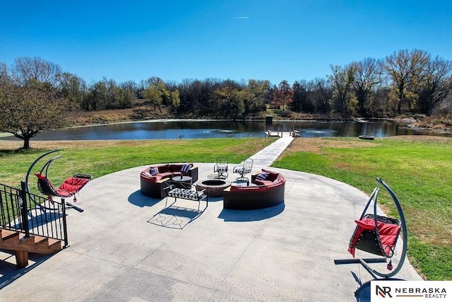 view of patio / terrace with a water view and an outdoor fire pit