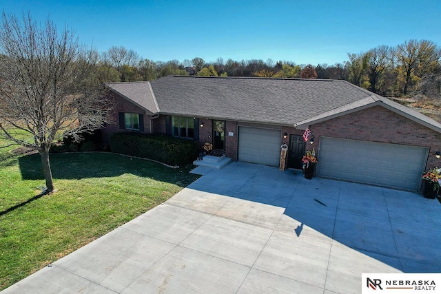 single story home featuring a front yard and a garage