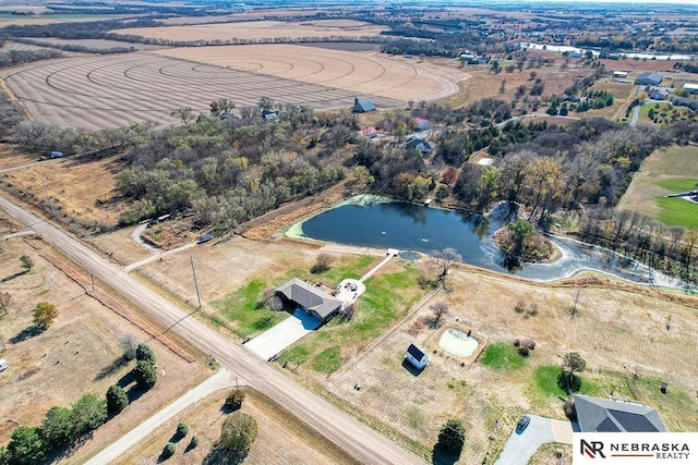 bird's eye view with a water view and a rural view