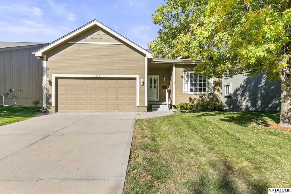 single story home with a front yard and a garage