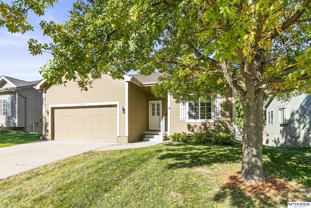 view of front of house with a front yard and a garage