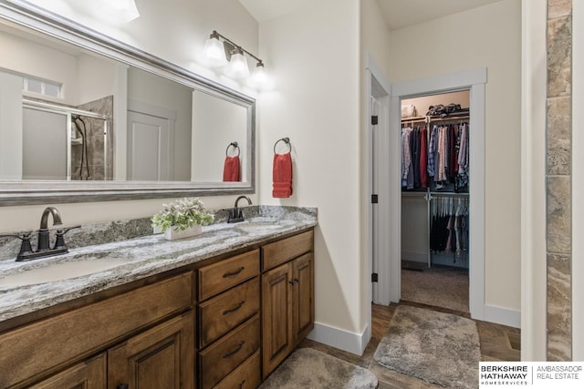 bathroom with vanity and an enclosed shower