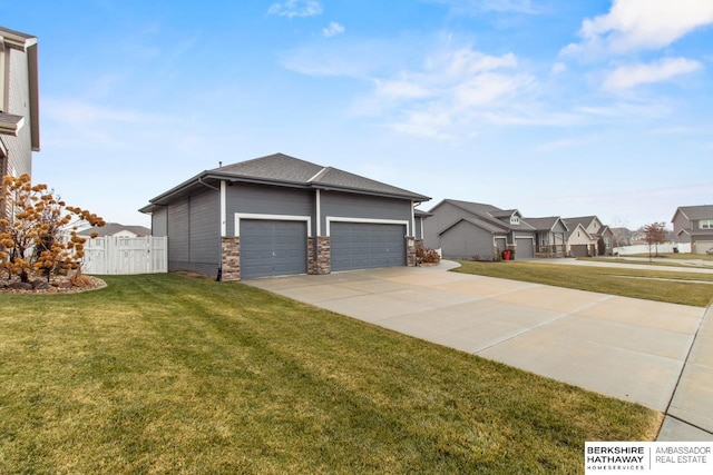 view of side of home with a yard