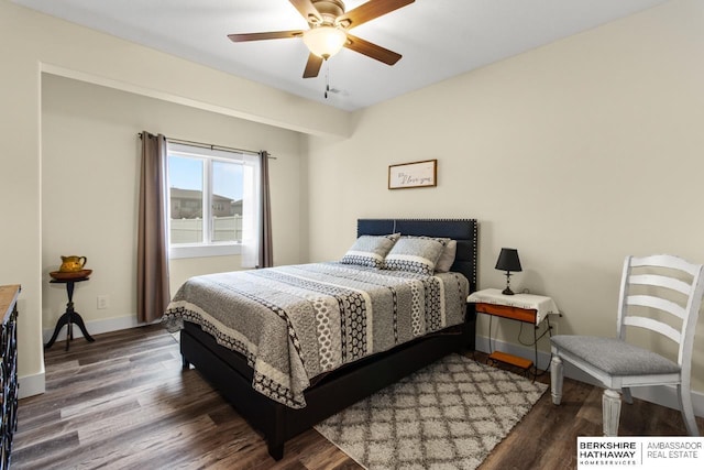 bedroom with dark hardwood / wood-style floors and ceiling fan