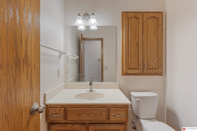 bathroom with vanity and toilet