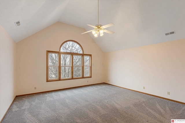 carpeted empty room featuring ceiling fan and vaulted ceiling