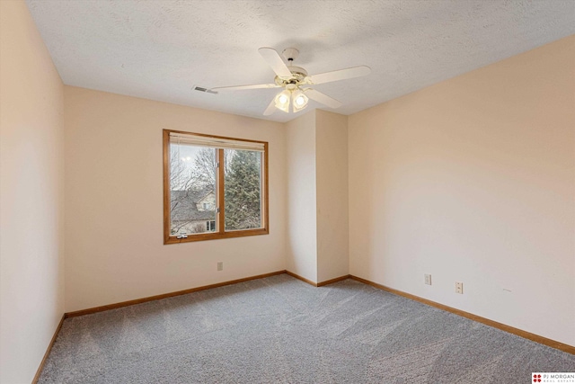 empty room with carpet, a textured ceiling, and ceiling fan