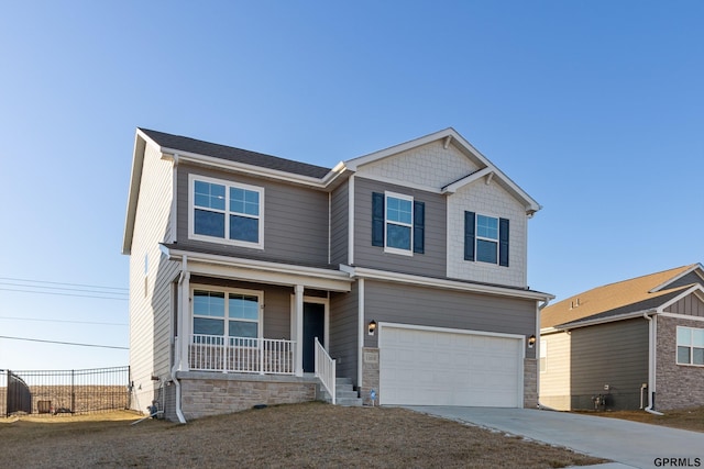 craftsman inspired home with a porch and a garage