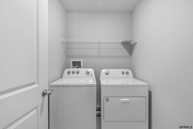 laundry room featuring washer and clothes dryer