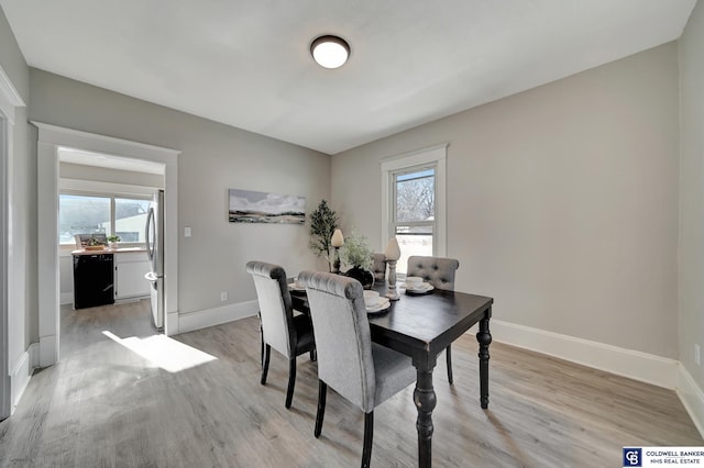 dining space with light wood-type flooring