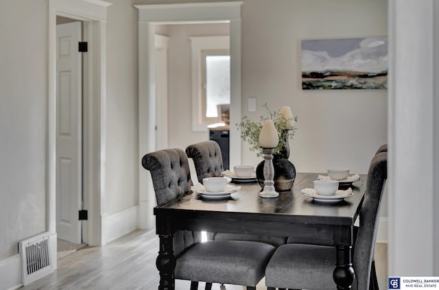 dining space featuring hardwood / wood-style flooring