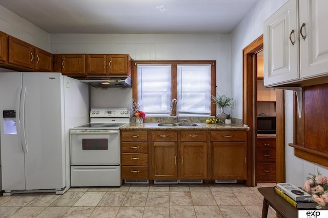 kitchen featuring sink and white appliances