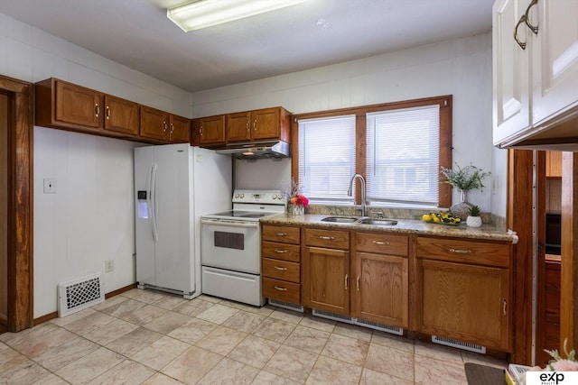 kitchen with white appliances and sink