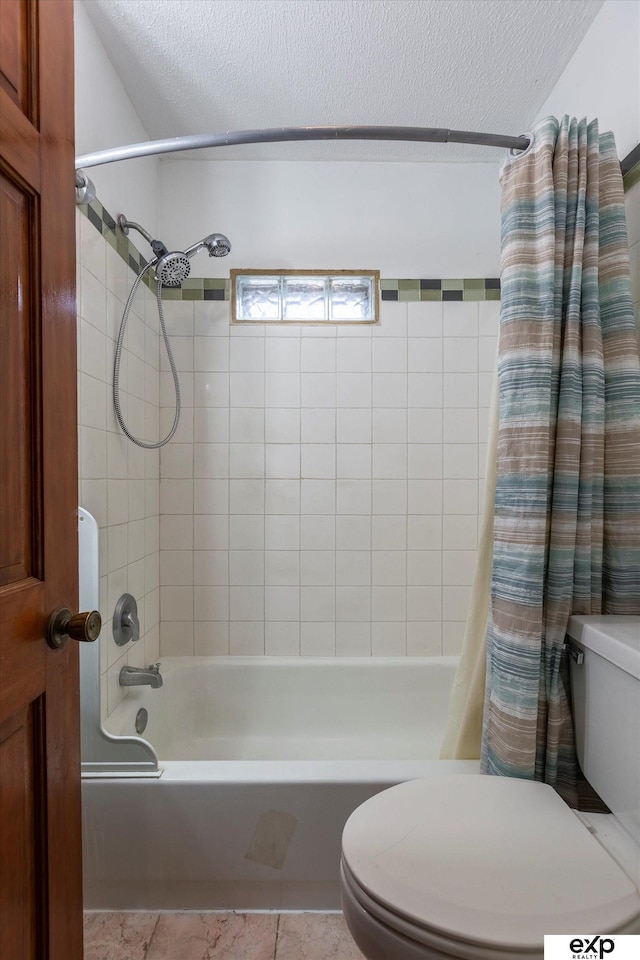 bathroom with shower / bathtub combination with curtain, a textured ceiling, and toilet